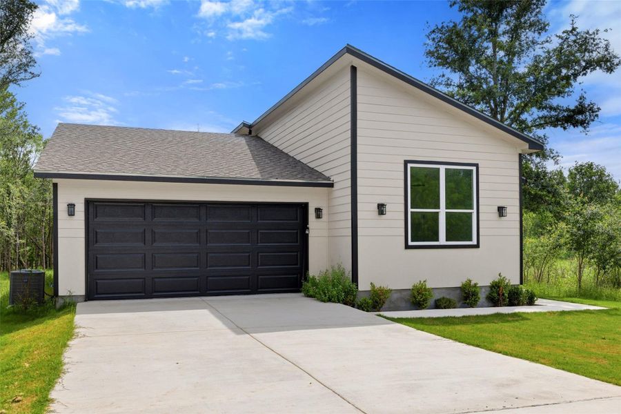 Front exterior of a new home in , Bastrop, TX, highlighting curb appeal (Image 1). Front exterior of a new home in , Bastrop, TX, highlighting curb appeal (Image 1).