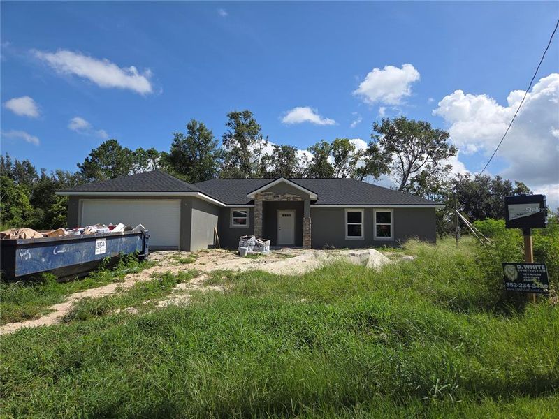 Front exterior of a new home in , Ocklawaha, FL, highlighting curb appeal (Image 1). Front exterior of a new home in , Ocklawaha, FL, highlighting curb appeal (Image 1).