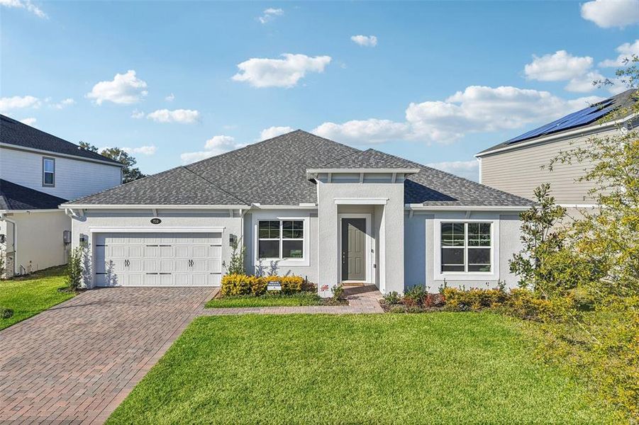 Front exterior of a new home in , Apopka, FL, highlighting curb appeal (Image 24).