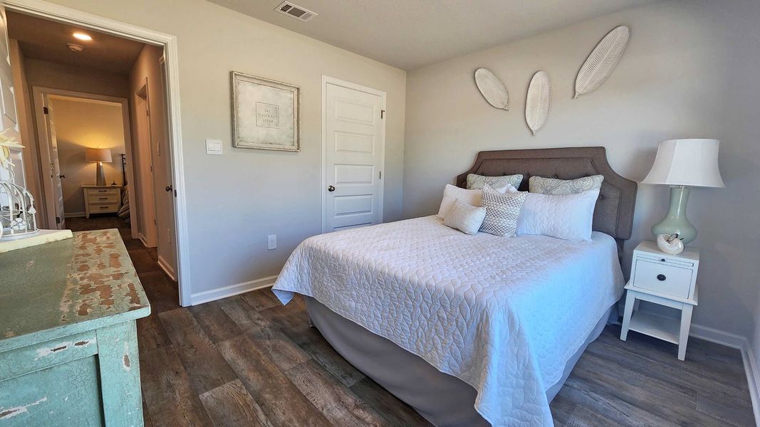 Furnished interior in a model home at Magnolia at the Bluffs Phase 3 in Freeport (Image 16).