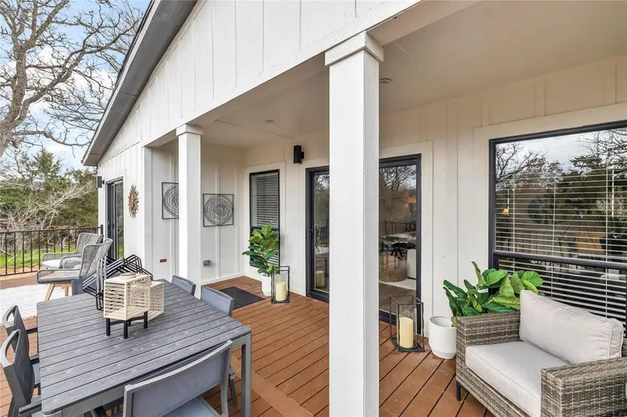 Wooden deck featuring outdoor dining space and outdoor lounge area