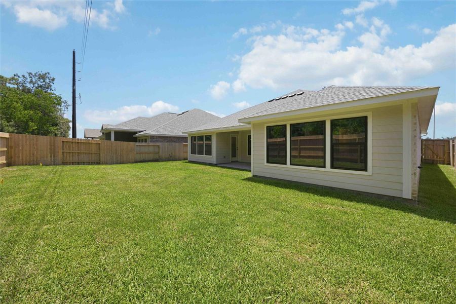 Exterior details and patio area of a home in Sundance Cove, Crosby (Image 17).