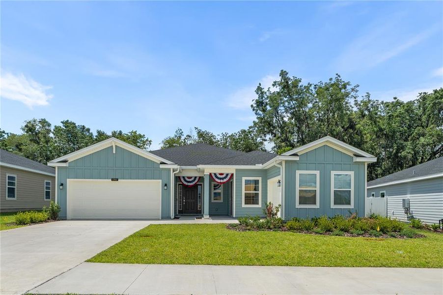 Front exterior of a new home in , Alachua, FL, highlighting curb appeal (Image 1). Front exterior of a new home in , Alachua, FL, highlighting curb appeal (Image 1).