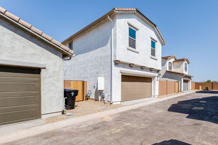 Front exterior of a new home in Avila at Rancho Mercado, Surprise, AZ, highlighting curb appeal (Image 19). Front exterior of a new home in Avila at Rancho Mercado, Surprise, AZ, highlighting curb appeal (Image 19).