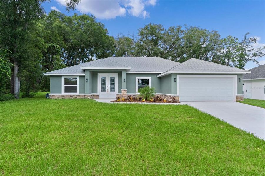 Front exterior of a new home in , Summerfield, FL, highlighting curb appeal (Image 23).