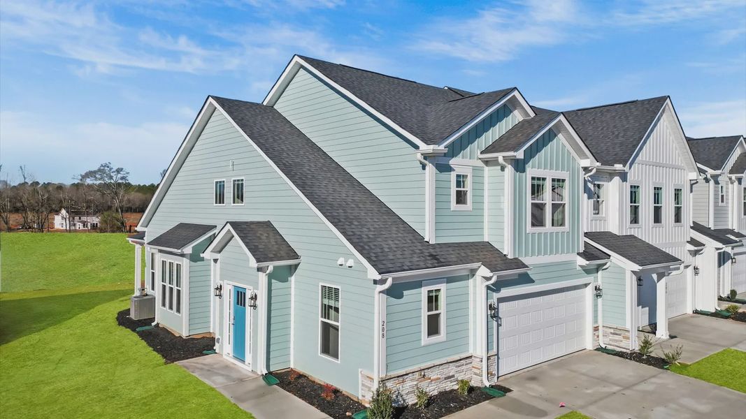 Front exterior of a new home in Village at Midway, Anderson, SC, highlighting curb appeal (Image 22).