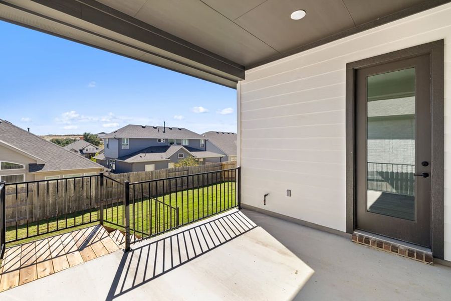Exterior details and patio area of a home in Park Collection at Lariat, Liberty Hill (Image 29).