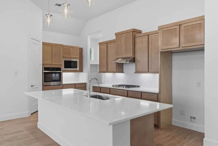 Representative furnished interior of a home built from the Summerton by Chesmar Homes in Beacon Point, Texas City (Image 6).