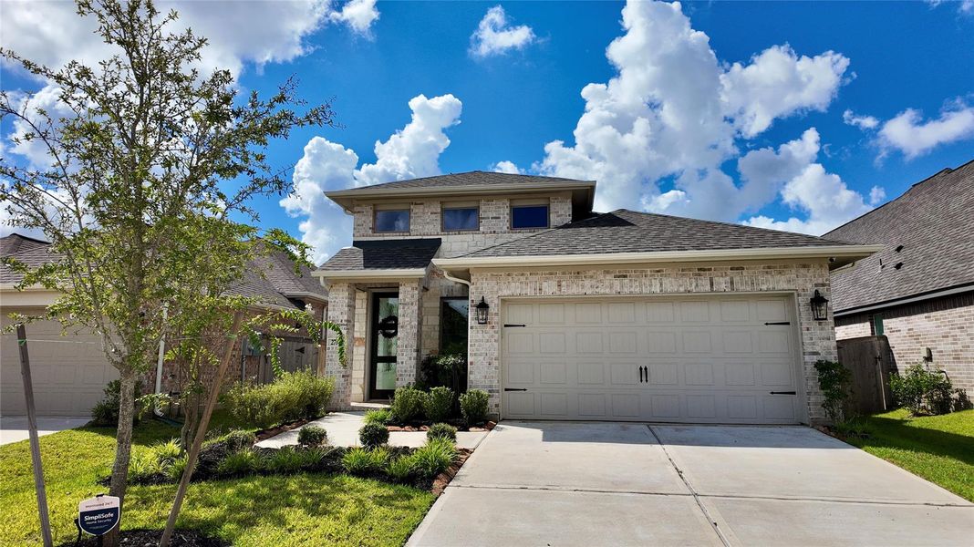 Front exterior of a new home in The Grand Prairie, Hockley, TX, highlighting curb appeal (Image 22).