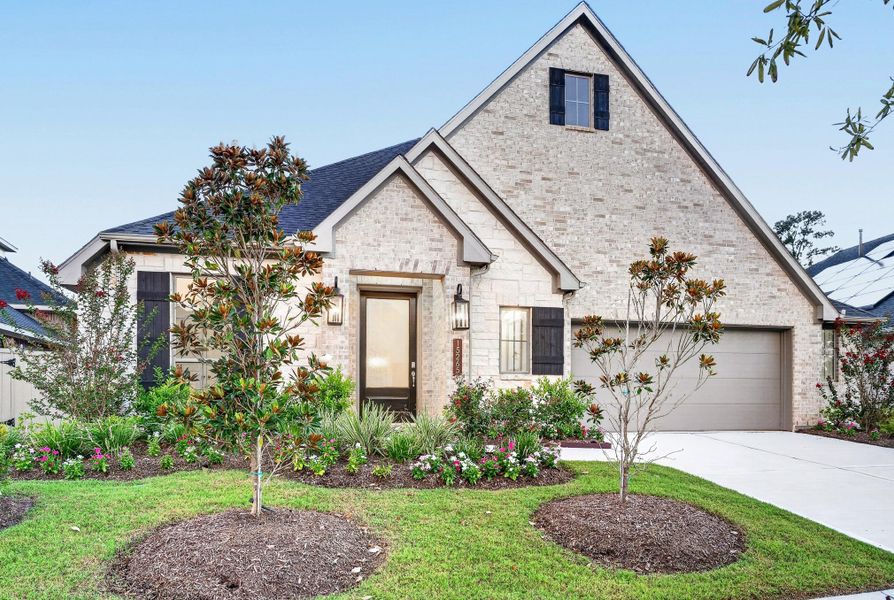 Front exterior of a new home in Audubon 60′, Magnolia, TX, highlighting curb appeal (Image 26). Front exterior of a new home in Audubon 60′, Magnolia, TX, highlighting curb appeal (Image 26).