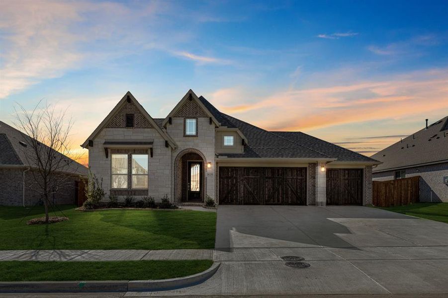 Front exterior of a new home in Terracina, Rockwall, TX, highlighting curb appeal (Image 2).