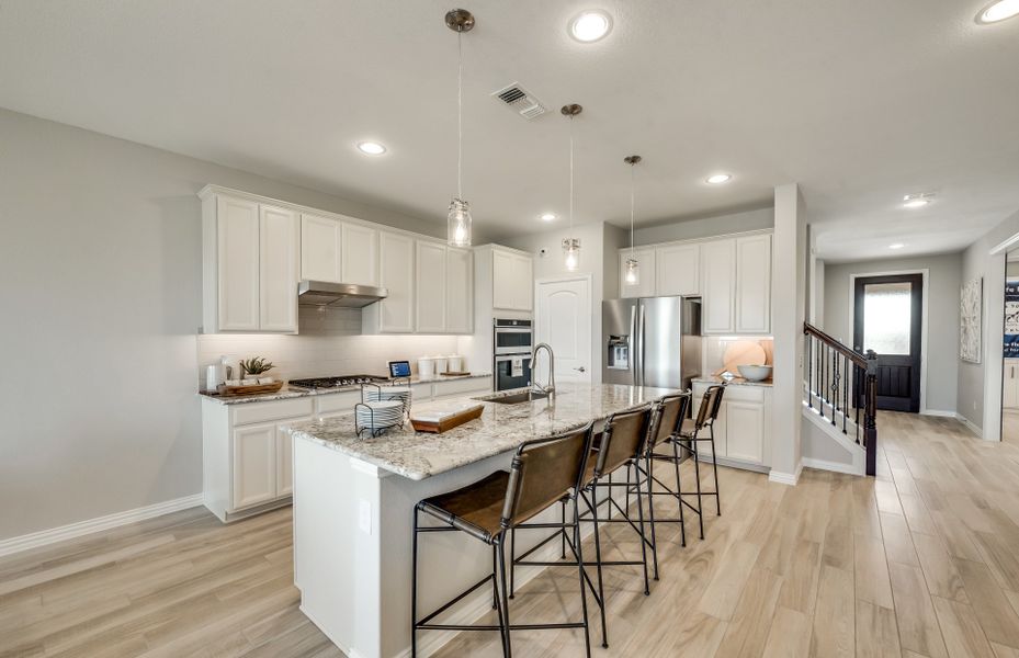 Spacious island kitchen with eat-in bartop