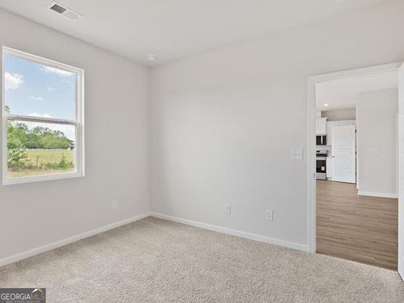 Spacious, unfurnished interior of a new home in Remington Chase, Perry (Image 15).