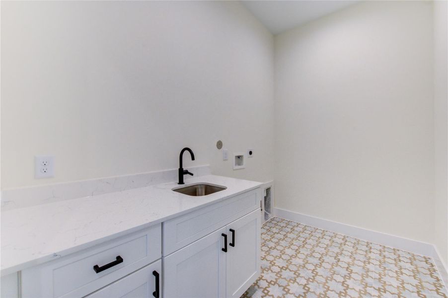 Conveniently located on the second floor near bedrooms, this spacious utility room features stunning tile flooring. Conveniently located on the second floor near bedrooms, this spacious utility room features stunning tile flooring.
