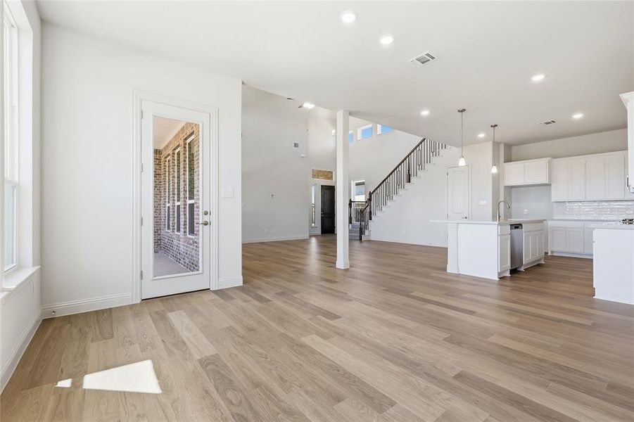 Unfurnished living room with light wood-type flooring and recessed lighting