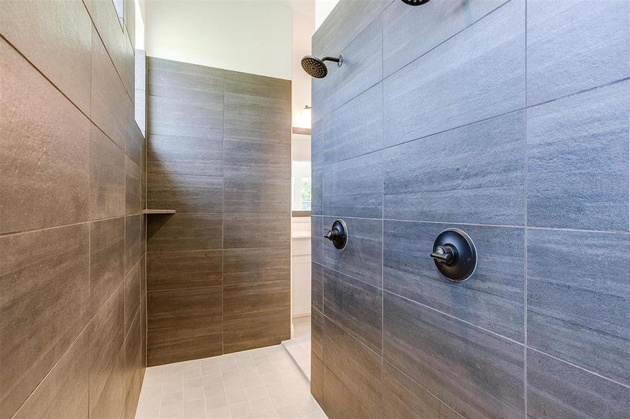 Bathroom featuring a tile shower