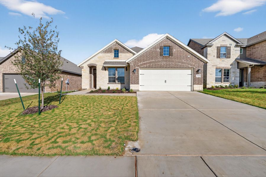 Front exterior of a new home in Liberty Pointe, Gainesville, TX, highlighting curb appeal (Image 1). Front exterior of a new home in Liberty Pointe, Gainesville, TX, highlighting curb appeal (Image 1).