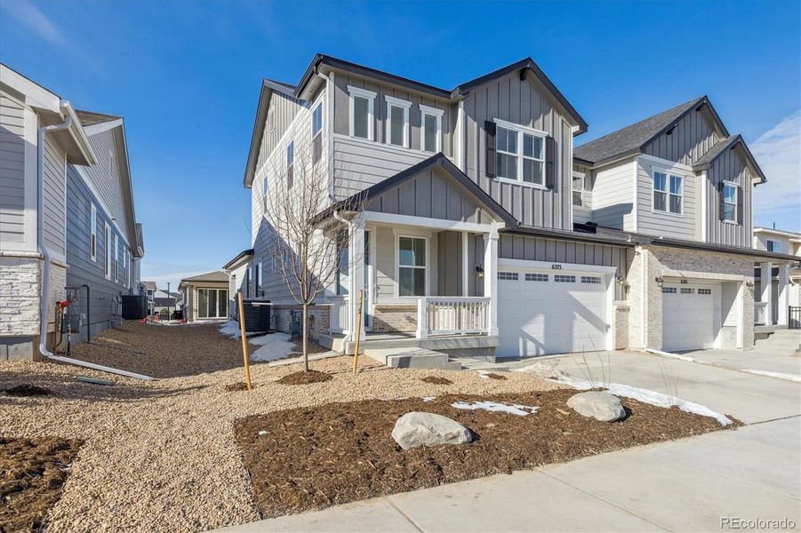 Front exterior of a new home in Skyview at High Point, Aurora, CO, highlighting curb appeal (Image 3). Front exterior of a new home in Skyview at High Point, Aurora, CO, highlighting curb appeal (Image 3).