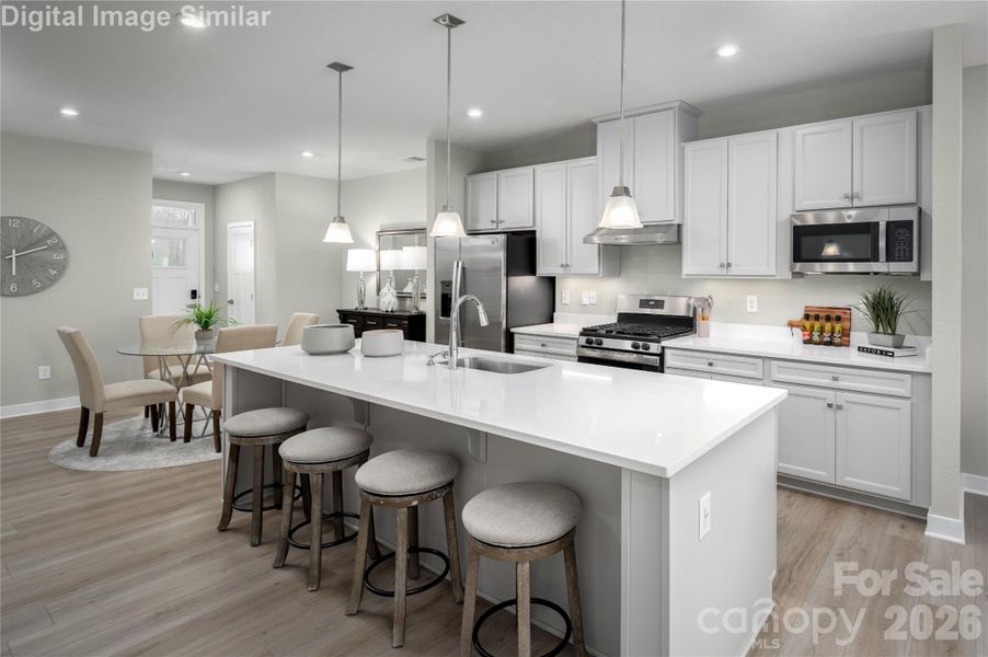 A home that greets you with warmth from the welcoming entrance foyer to the heart of the kitchen. The open layout flows into a stylish dining area and spacious island, offering seating for at least 8 guests. It’s always “din din” time in this vibrant, social space made for connection, comfort, and celebration.