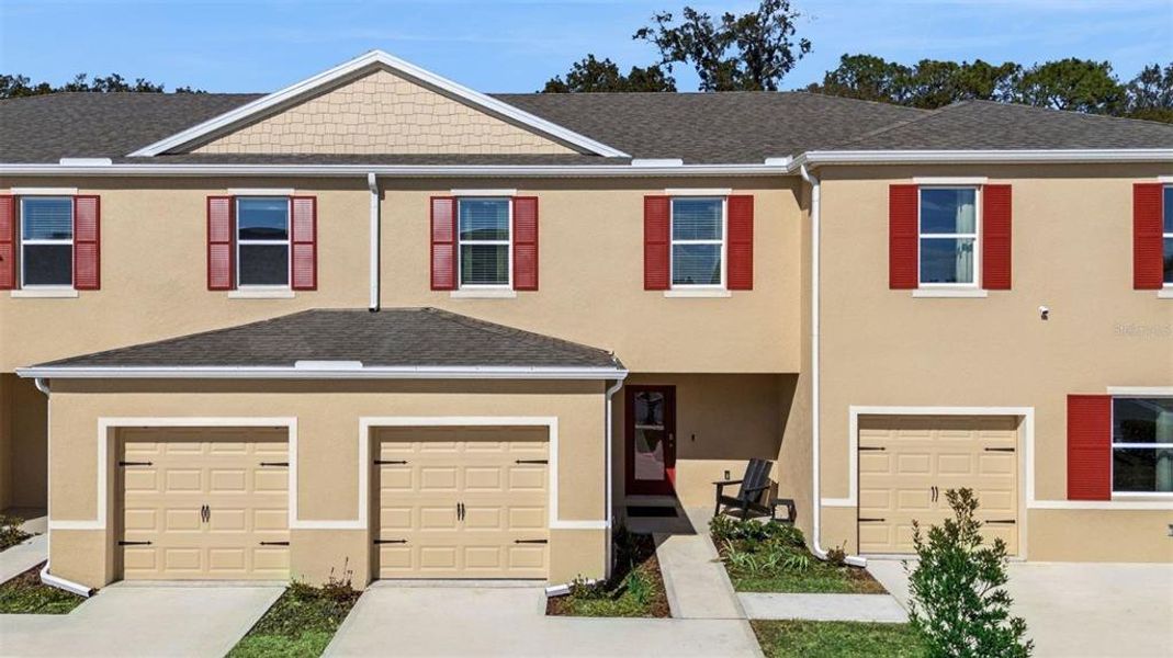 Front exterior of a new home in Oak Pointe, Apopka, FL, highlighting curb appeal (Image 1). Front exterior of a new home in Oak Pointe, Apopka, FL, highlighting curb appeal (Image 1).