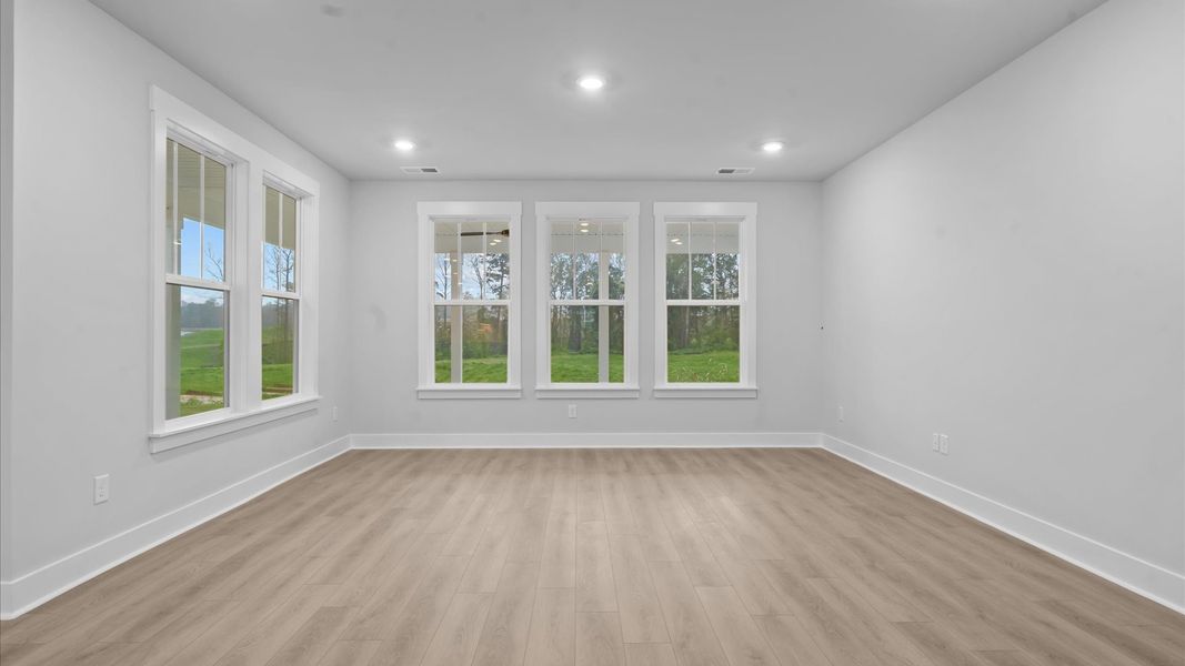 Elegant family room with hardwood flooring and open-concept flow in this first-class DRB Homes design Elegant family room with hardwood flooring and open-concept flow in this first-class DRB Homes design