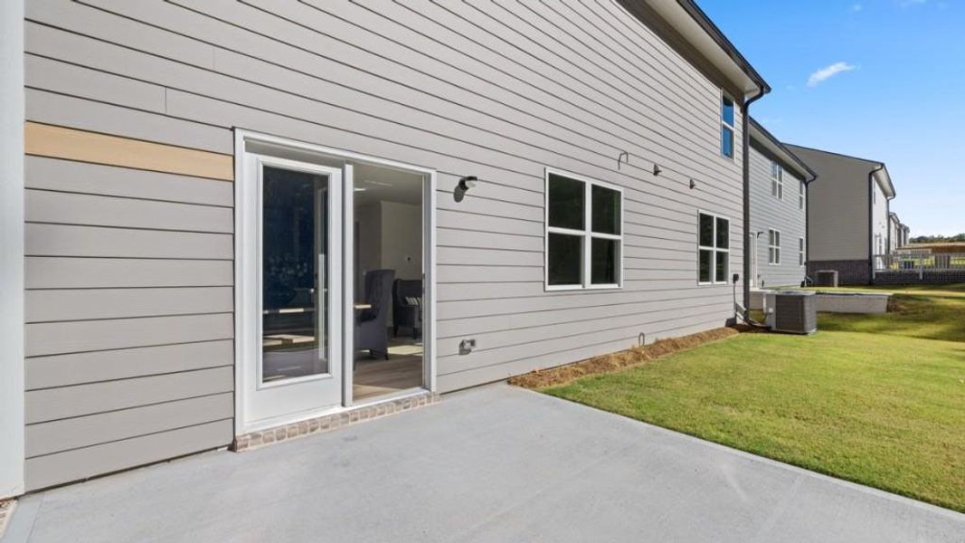 Exterior details and patio area of a home in Hamptons at Riverwood South, Dallas (Image 25).