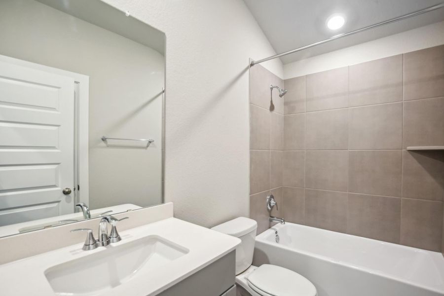 Furnished interior view inside a new home in Massey Oaks - Premier Series, Pearland (Image 16). Furnished interior view inside a new home in Massey Oaks - Premier Series, Pearland (Image 16).