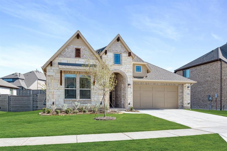 Front exterior of a new home in Union Park Classic 60, Little Elm, TX, highlighting curb appeal (Image 2).