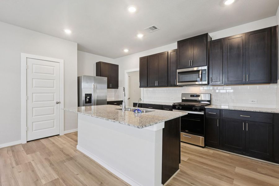 Photo is not of the actual home, but is an inspirational photo of builder’s model home and may depict options, furnishings, and/or decorator features that are not included