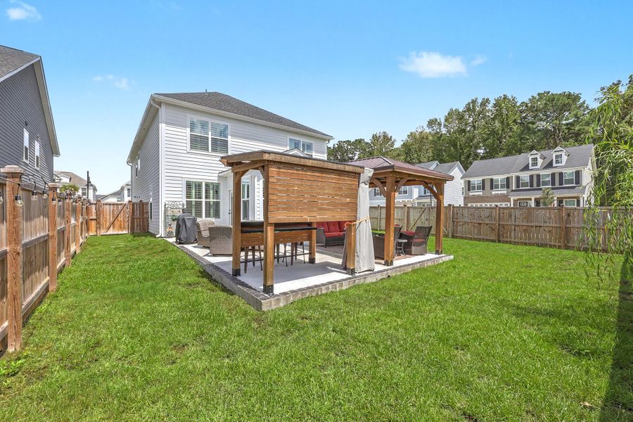 Exterior details and patio area of a home in , Johns Island (Image 31).