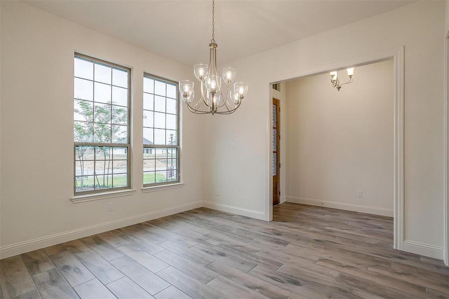 Unfurnished dining area featuring light hardwood / wood-style floors