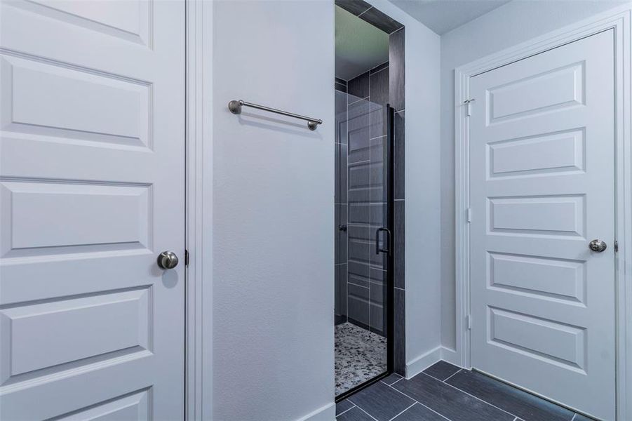 Bathroom featuring a shower with shower door