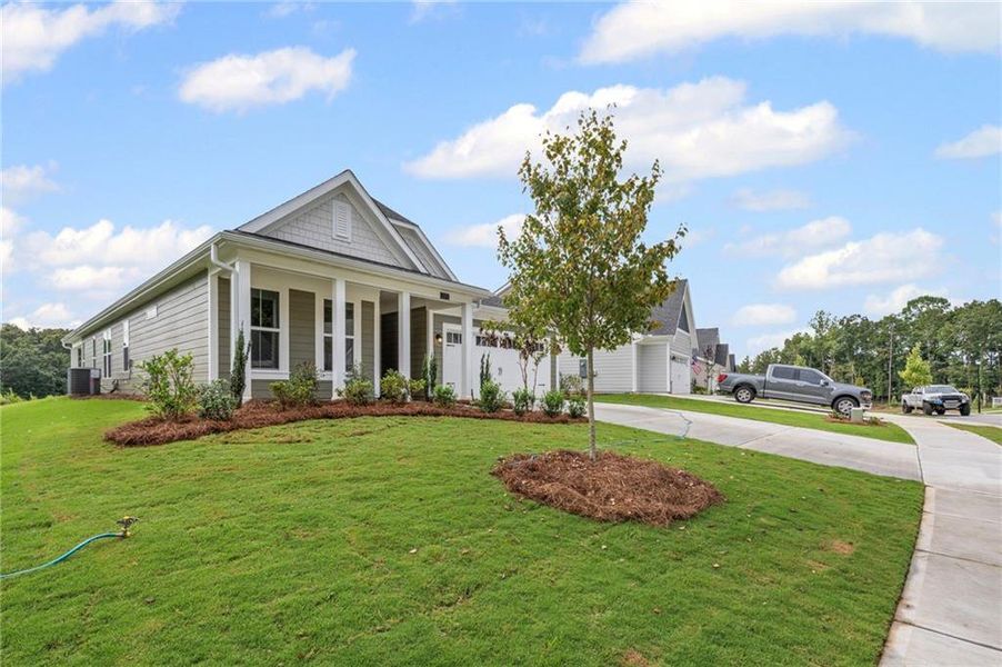 Front exterior of a new home in The Reserve At Liberty Park, Braselton, GA, highlighting curb appeal (Image 18). Front exterior of a new home in The Reserve At Liberty Park, Braselton, GA, highlighting curb appeal (Image 18).