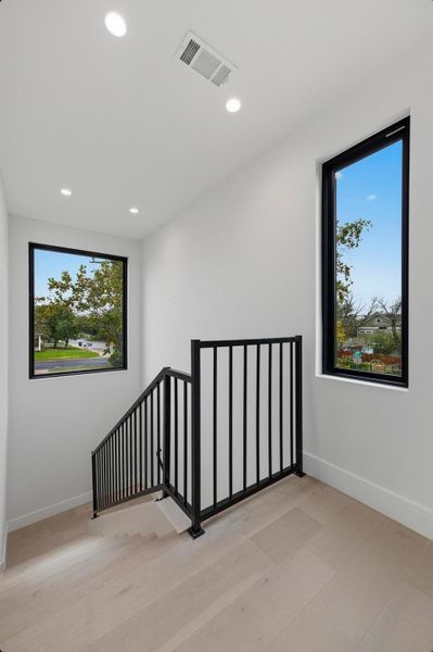 Unfurnished room with recessed lighting and light wood finished floors