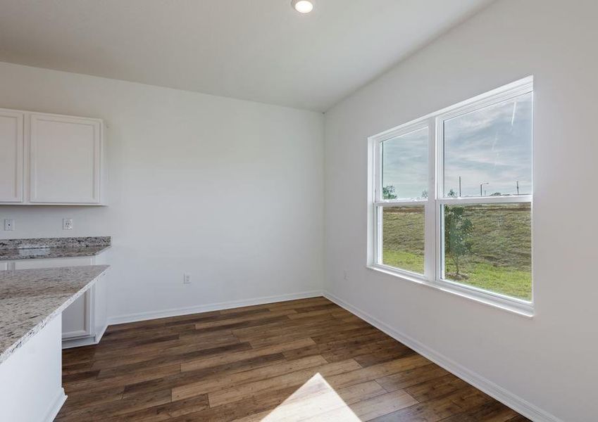 The dining space is right of the kitchen, making it easy to host