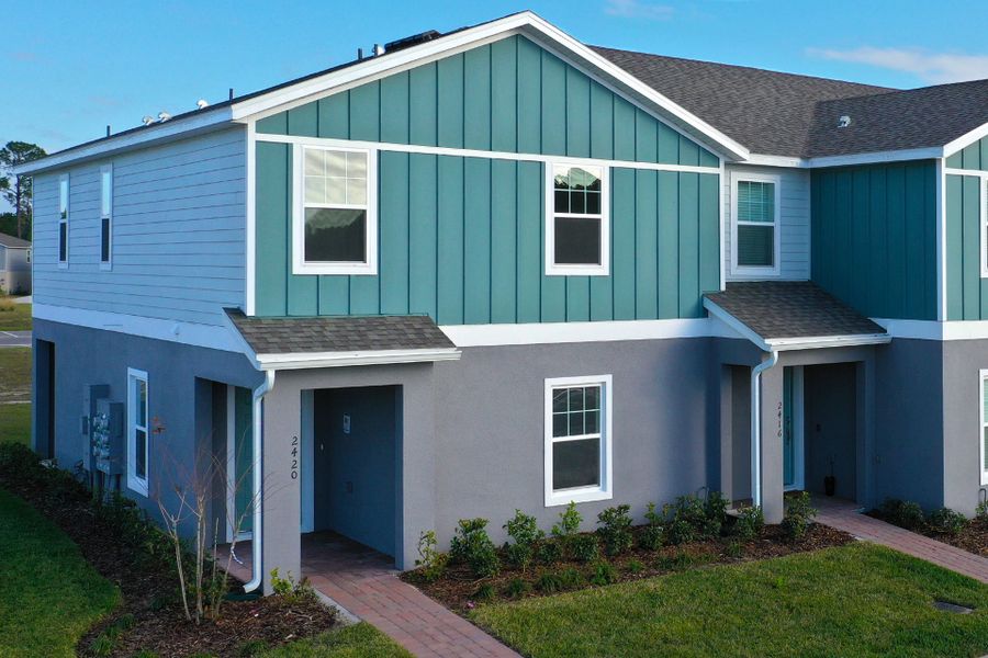 Ashley townhome exterior with covered porch in Pine Meadows, new construction in Eustis FL