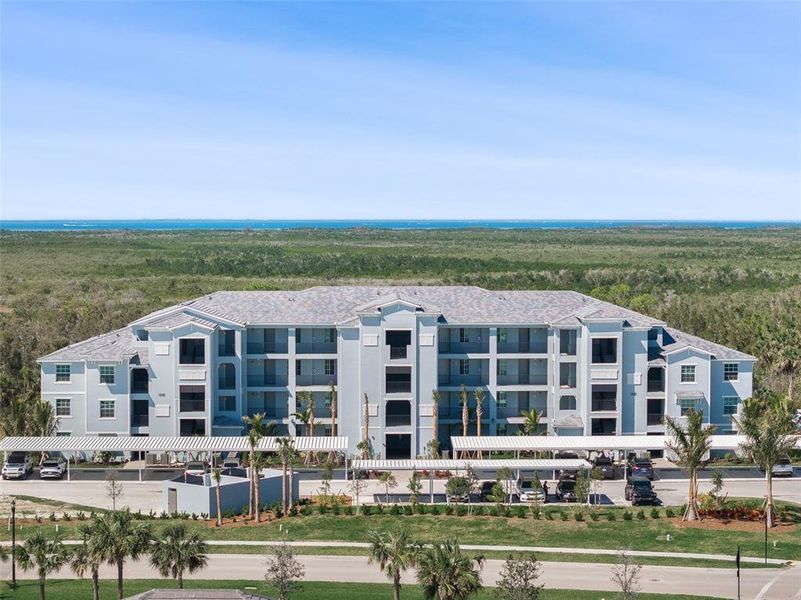 Front exterior of a new home in Heritage Landing: Veranda Condominiums, Punta Gorda, FL, highlighting curb appeal (Image 2).