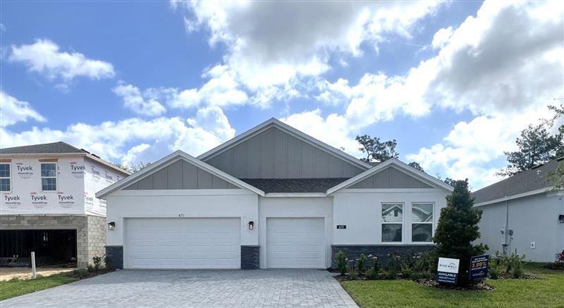 Front exterior of a new home in Trinity Gardens, Deland, FL, highlighting curb appeal (Image 1). Front exterior of a new home in Trinity Gardens, Deland, FL, highlighting curb appeal (Image 1).