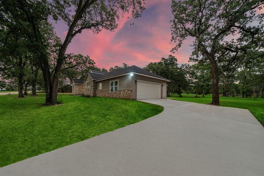 Complete with an expansive driveway and a blend of modern design and timeless charm.