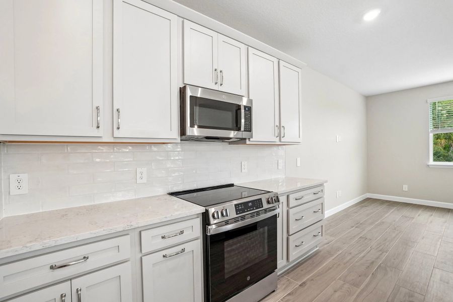 AW Collection® Milan features beautiful gray cabinets with a stunning backsplash