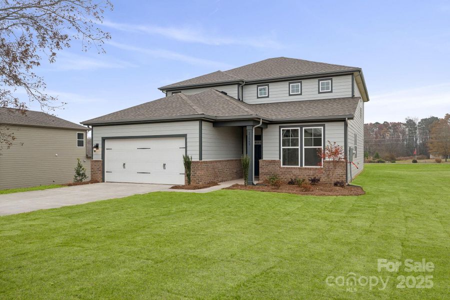 Front exterior of a new home in Running Creek, Locust, NC, highlighting curb appeal (Image 6). Front exterior of a new home in Running Creek, Locust, NC, highlighting curb appeal (Image 6).