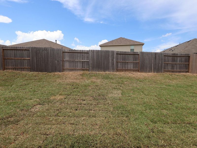 Front exterior of a new home in Moran Ranch, Willis, TX, highlighting curb appeal (Image 10). Front exterior of a new home in Moran Ranch, Willis, TX, highlighting curb appeal (Image 10).