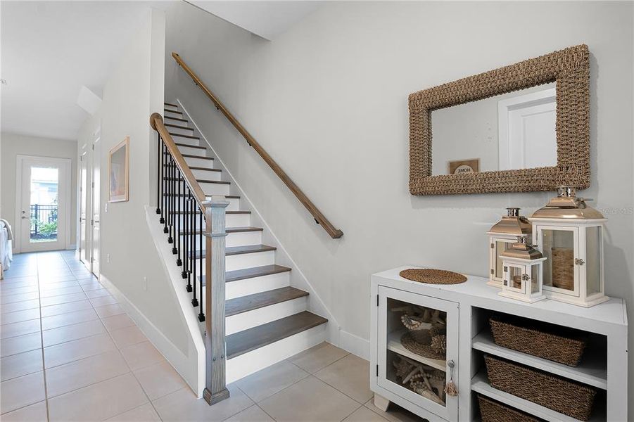 Entry with upgraded wood stairs Entry with upgraded wood stairs