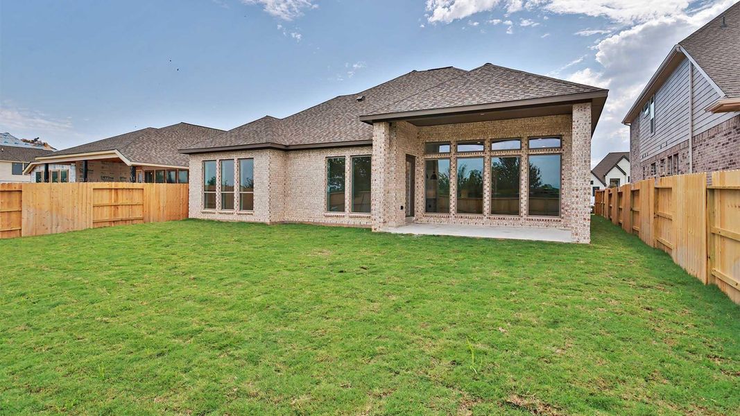 Exterior details and patio area of a home in Lakes of Cane Island, Katy (Image 3).
