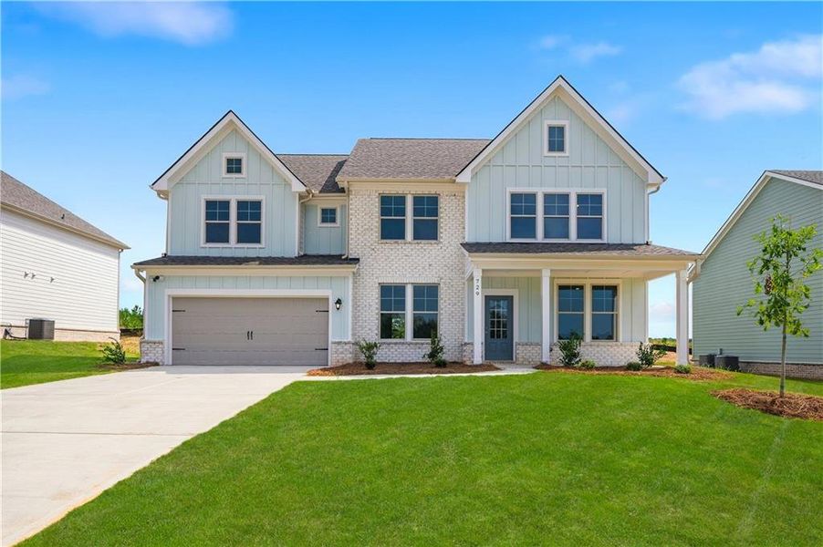 Front exterior of a new home in Brighton, Locust Grove, GA, highlighting curb appeal (Image 17).