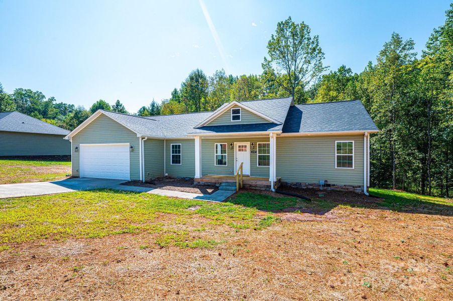 Front exterior of a new home in , Newton, NC, highlighting curb appeal (Image 14).