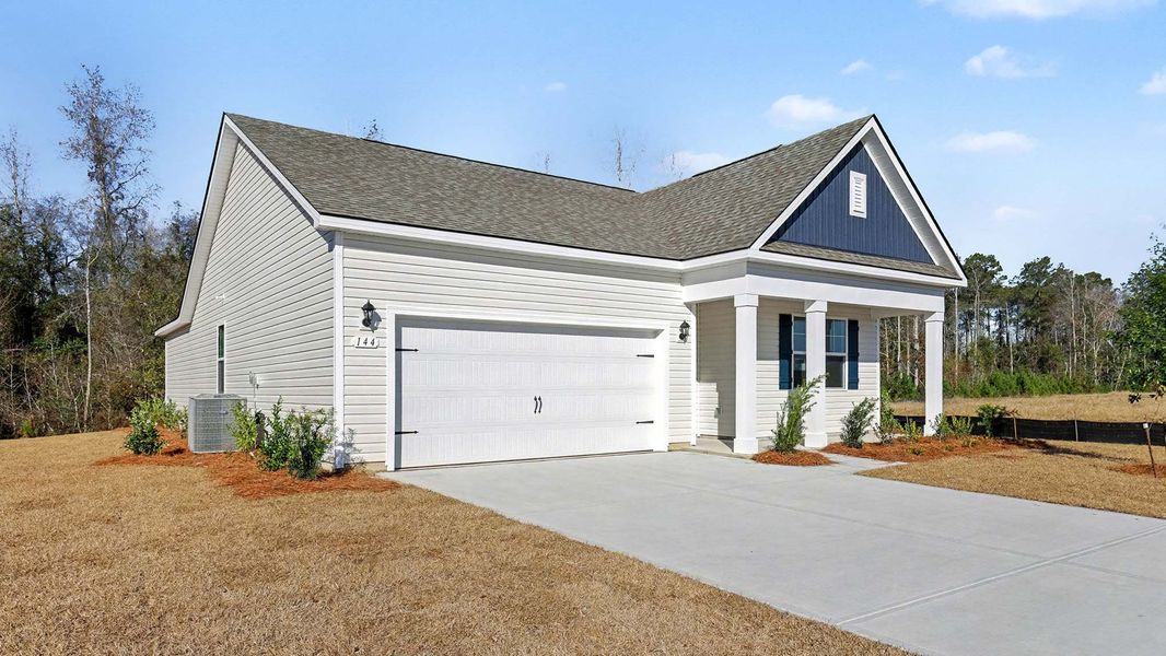 Front exterior of a new home in Pinewood Estates, Conway, SC, highlighting curb appeal (Image 2). Front exterior of a new home in Pinewood Estates, Conway, SC, highlighting curb appeal (Image 2).