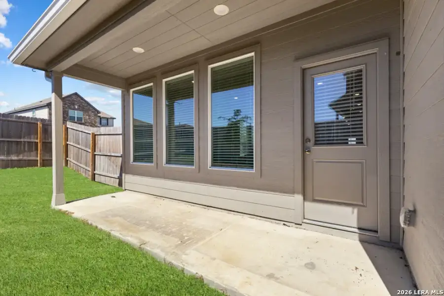 Exterior details and patio area of a home in Hightop Ridge, Converse (Image 27).