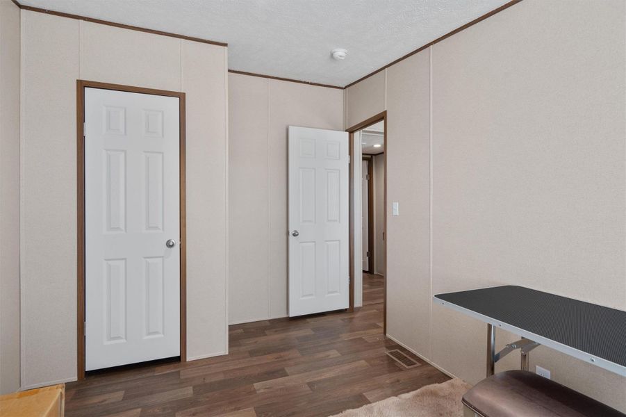 Clean lines and durable wood-look flooring define this versatile interior transition area.