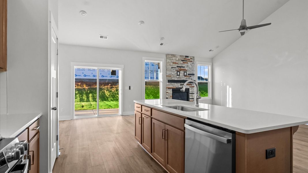 Modern kitchen with streamlined island for easy prep, storage, and gathering